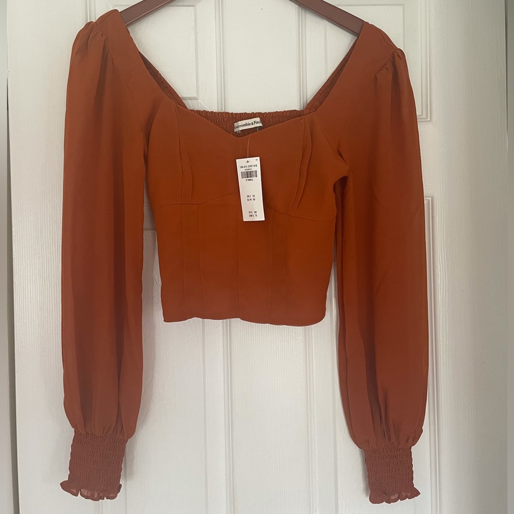 Rust colored women’s blouse